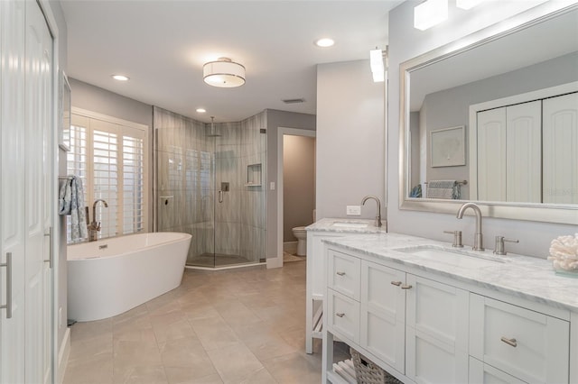 full bathroom with vanity, toilet, independent shower and bath, and tile patterned flooring