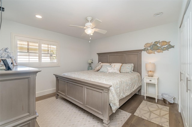 bedroom with light hardwood / wood-style flooring and ceiling fan