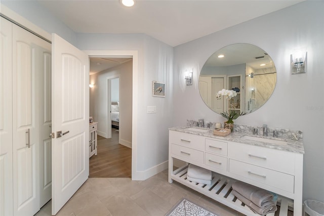 bathroom featuring vanity and hardwood / wood-style flooring