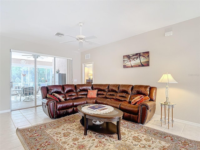 living room featuring light tile patterned flooring and ceiling fan