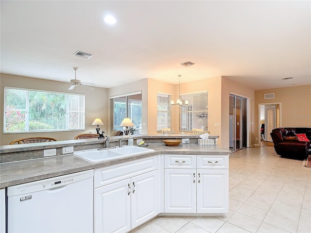 kitchen with white cabinetry, dishwasher, sink, ceiling fan with notable chandelier, and decorative light fixtures