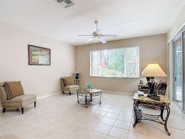 sitting room featuring ceiling fan and light tile patterned floors