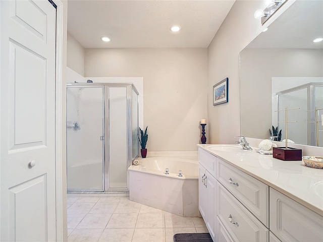 bathroom featuring vanity, plus walk in shower, and tile patterned floors