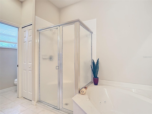 bathroom featuring toilet, independent shower and bath, and tile patterned floors