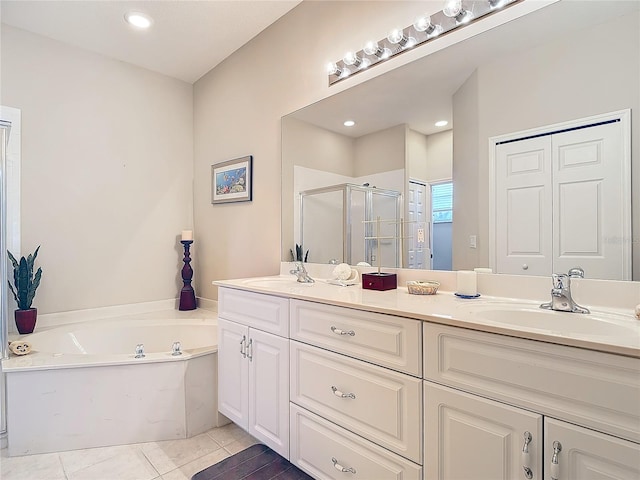 bathroom featuring vanity, tile patterned floors, and shower with separate bathtub