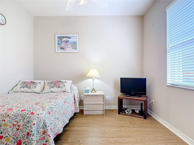 bedroom featuring hardwood / wood-style flooring and ceiling fan