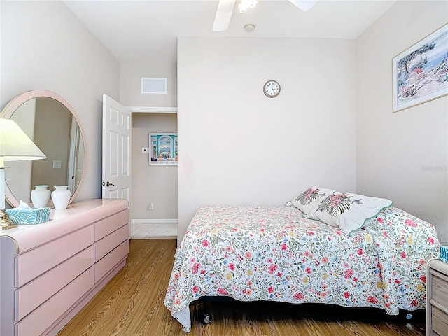 bedroom featuring ceiling fan and light hardwood / wood-style flooring