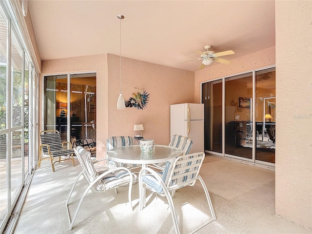 view of patio featuring ceiling fan