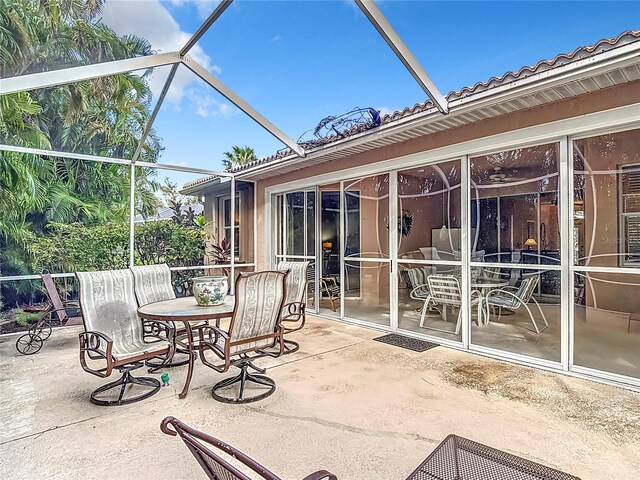 view of patio with a lanai