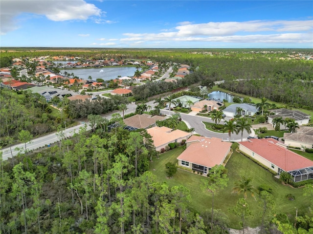 20607 Dennisport Ln, North Fort Myers, FL 33917 - birds eye view of property with a wooded view, a water view, and a residential view