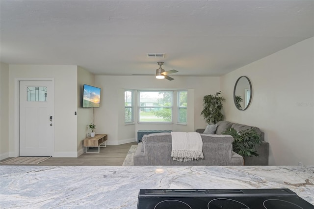 bedroom with light wood-type flooring and ceiling fan