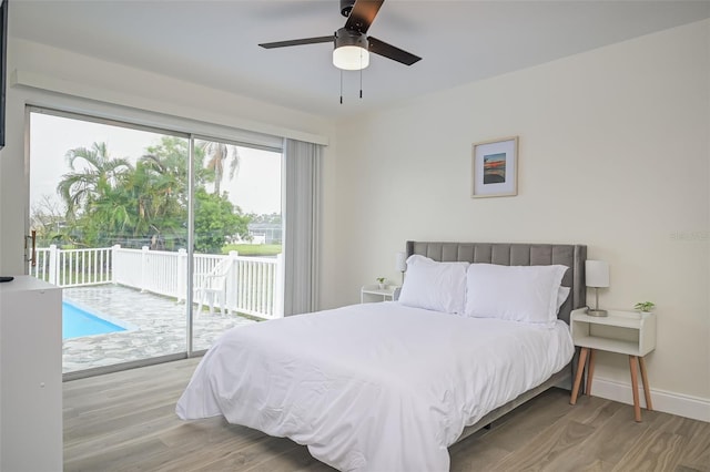 bedroom featuring access to exterior, light wood-type flooring, and ceiling fan