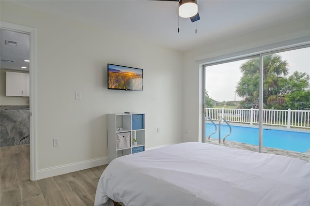 bedroom featuring access to outside, light wood-type flooring, and ceiling fan