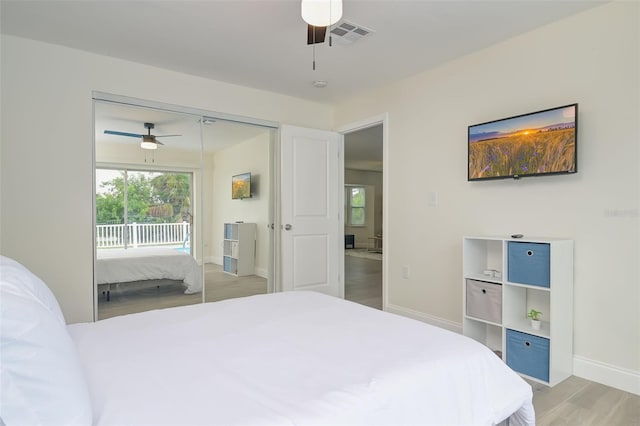 bedroom featuring a closet, ceiling fan, and light hardwood / wood-style floors