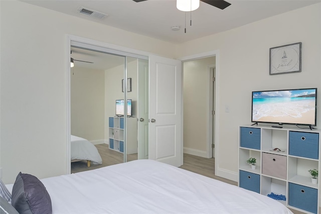 bedroom featuring a closet, ceiling fan, and hardwood / wood-style floors