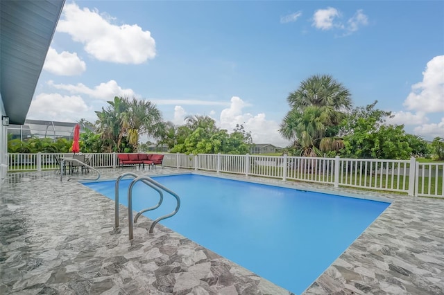 view of swimming pool with a patio