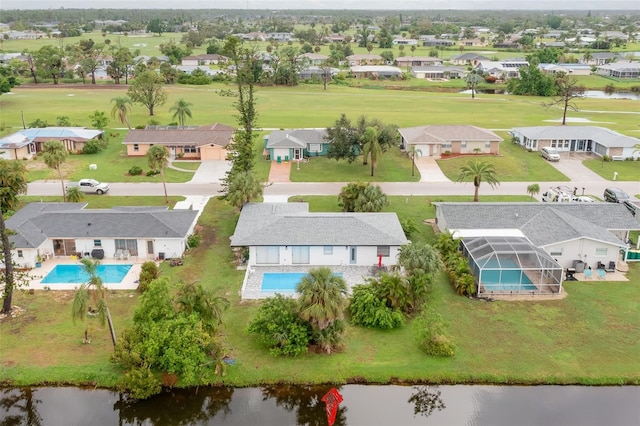 25 Caddy Rd, Rotonda West, FL 33947 - aerial perspective of suburban area with a pool area and a nearby body of water