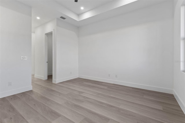 unfurnished room featuring light wood-type flooring