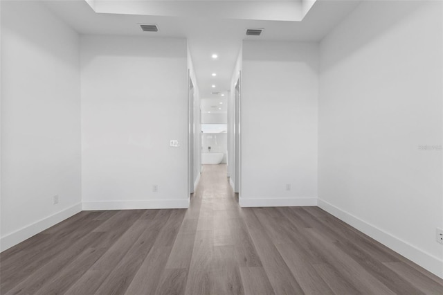 unfurnished room featuring hardwood / wood-style flooring