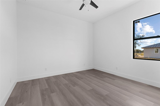 spare room with light hardwood / wood-style floors and ceiling fan