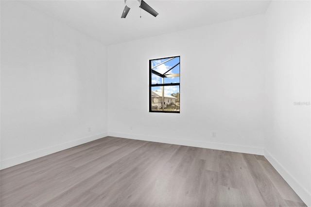 spare room featuring ceiling fan and light hardwood / wood-style floors