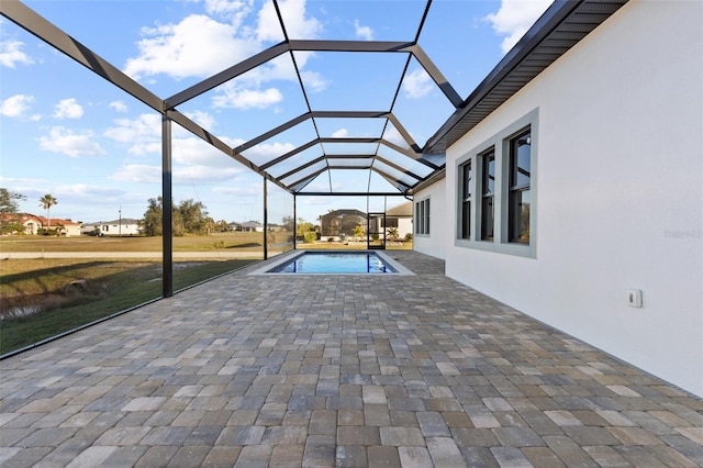 view of pool with a lanai