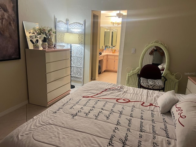 bedroom featuring light tile patterned floors and ensuite bath