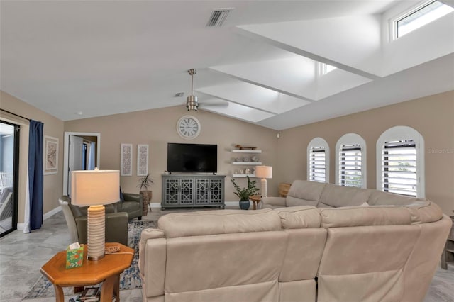 living room with vaulted ceiling and a wealth of natural light