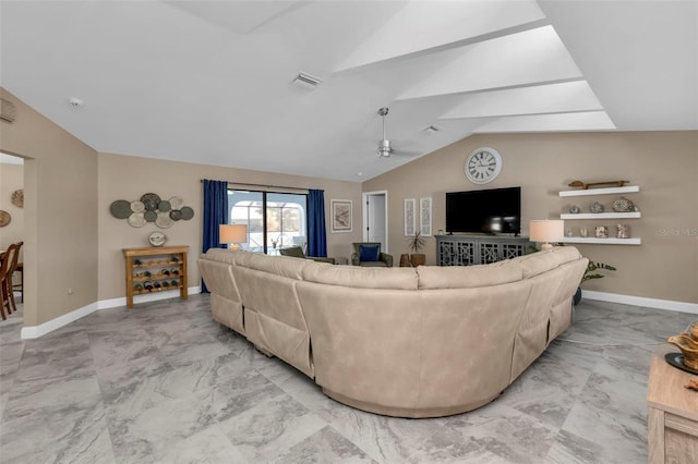 living room with vaulted ceiling with skylight and ceiling fan