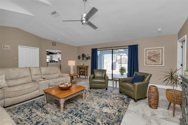 living room featuring ceiling fan and vaulted ceiling