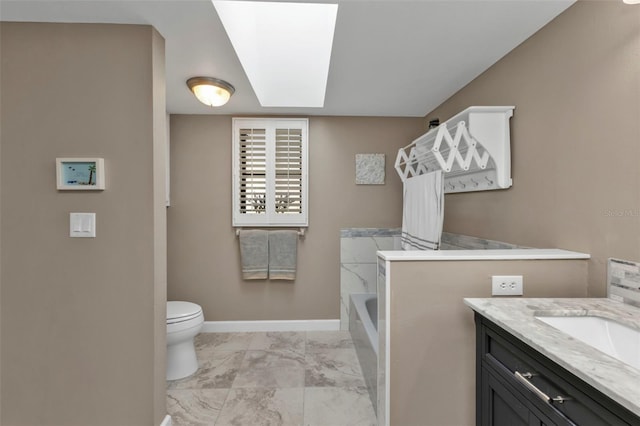 full bathroom featuring vanity, independent shower and bath, toilet, and a skylight