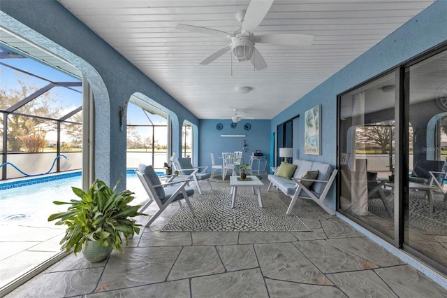 unfurnished sunroom with a healthy amount of sunlight and ceiling fan