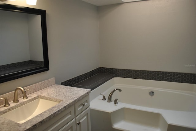 bathroom featuring vanity and a bathtub