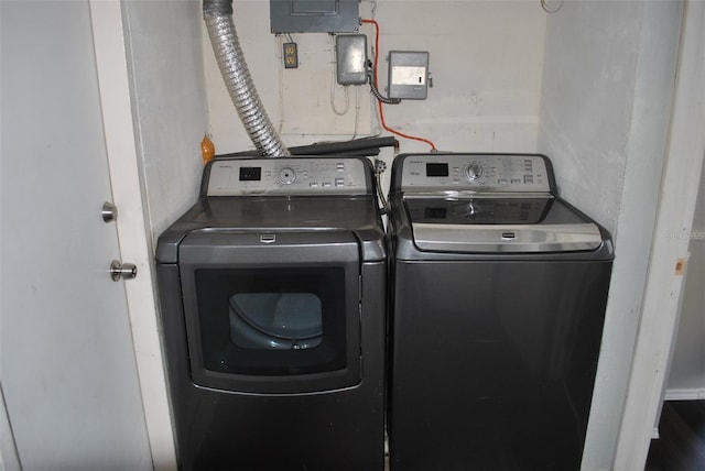 clothes washing area with independent washer and dryer