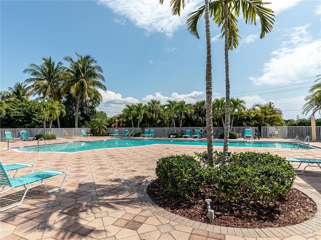 view of swimming pool with a patio