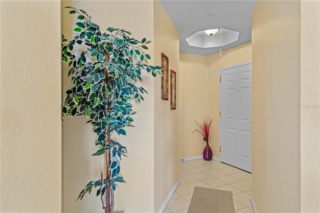 corridor featuring light tile patterned flooring