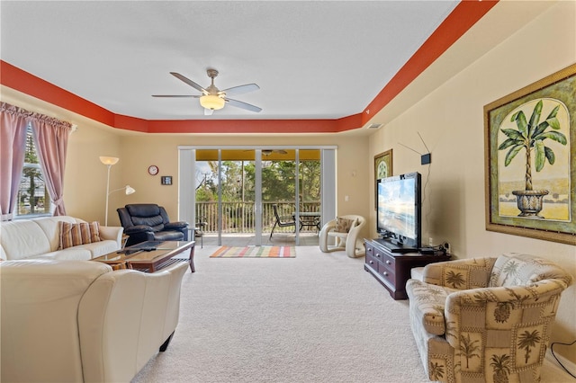 living room featuring light carpet and ceiling fan