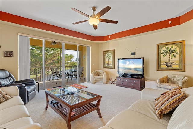 living room featuring light carpet and ceiling fan