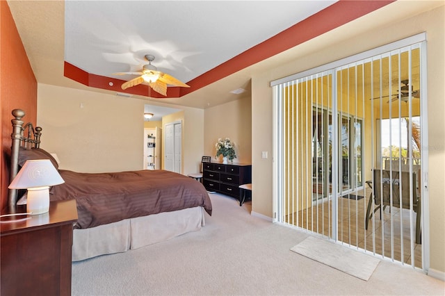 bedroom featuring access to outside, carpet, a closet, and ceiling fan