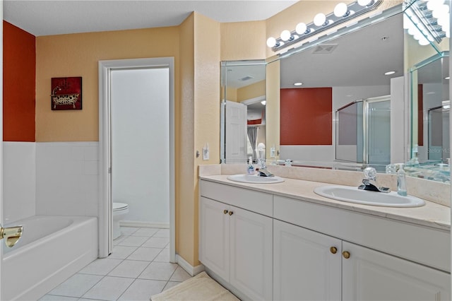 full bathroom with vanity, toilet, shower with separate bathtub, and tile patterned flooring