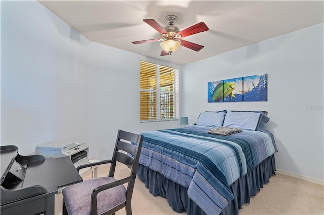 bedroom featuring ceiling fan and light carpet