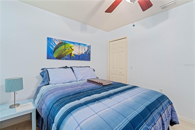 bedroom featuring a closet, carpet flooring, and ceiling fan