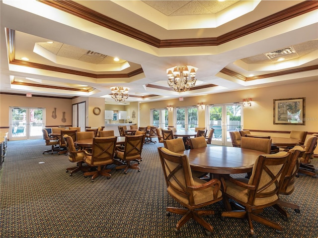 carpeted dining room with french doors, a tray ceiling, and crown molding