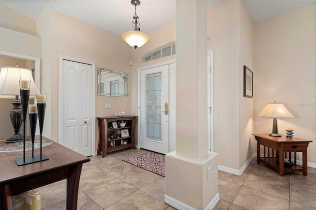 foyer featuring light tile patterned flooring