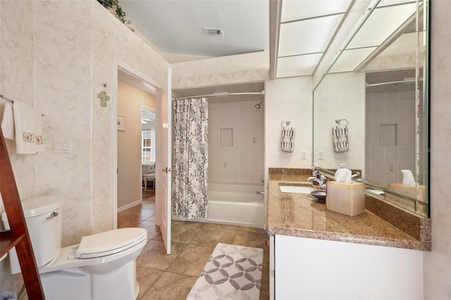 full bathroom with a textured ceiling, shower / bathtub combination with curtain, tile patterned flooring, vanity, and toilet