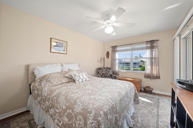 bedroom featuring hardwood / wood-style floors, a closet, and ceiling fan