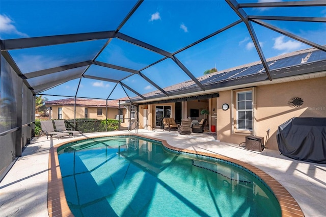 view of swimming pool with a lanai, grilling area, and a patio