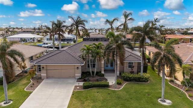 view of front of house featuring a garage and a front yard