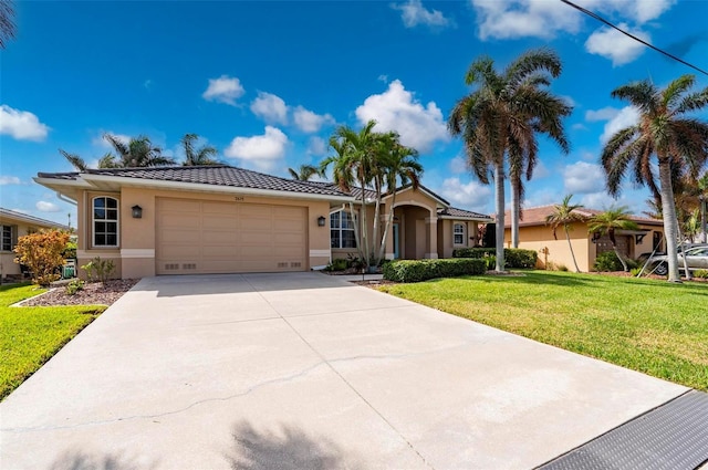 ranch-style house with a garage and a front yard