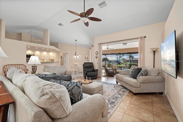 tiled living room with ceiling fan and lofted ceiling